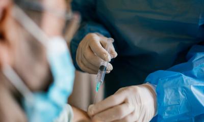 Medical provider administering vaccine