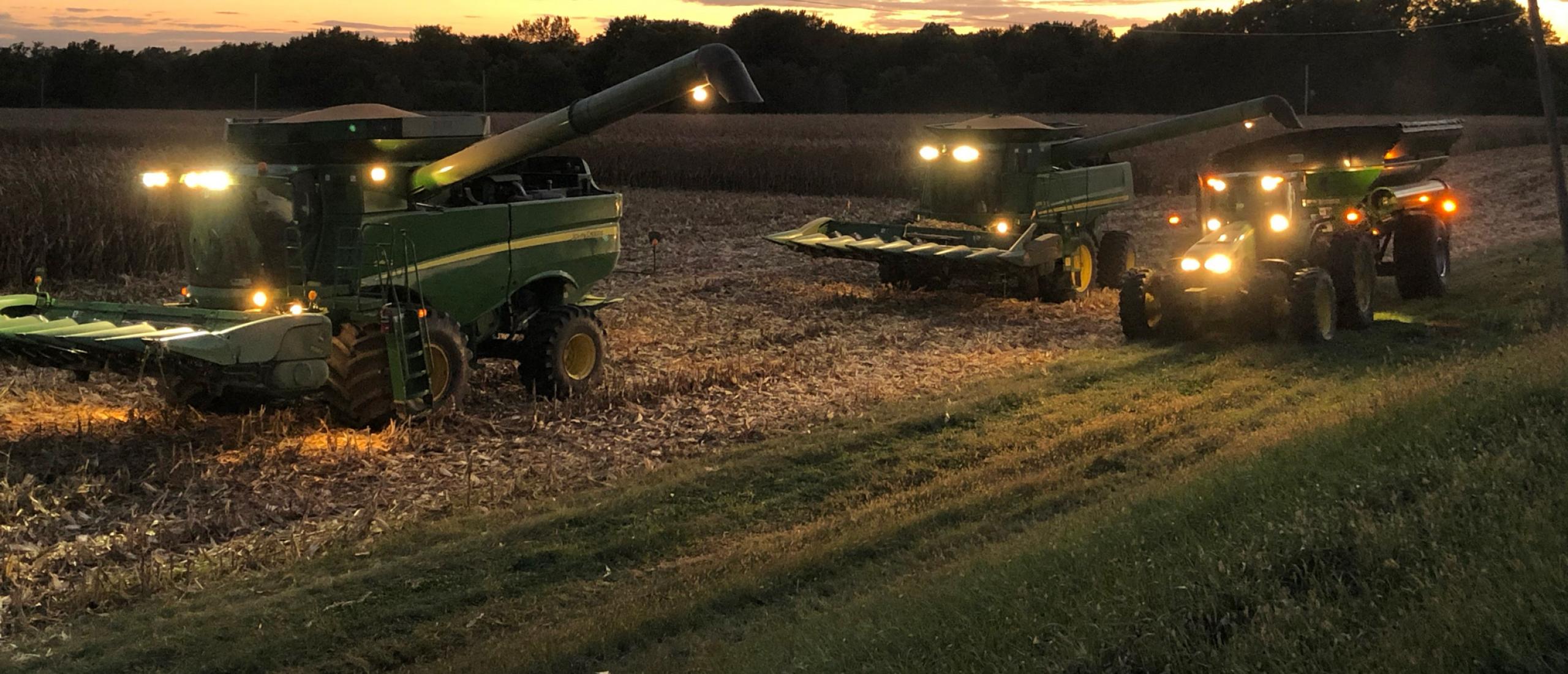 harvesters hard at work in fields